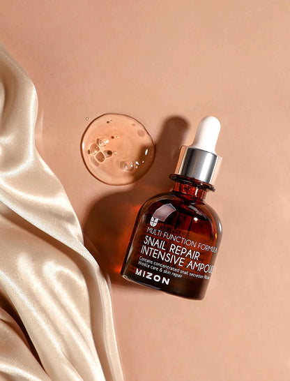 MIZON Snail Repair Intensive Ampoule veido serumas su sraigių sekretu